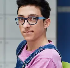 Middle School Student With Glasses and Overalls - MUSE Global School Five Pillars