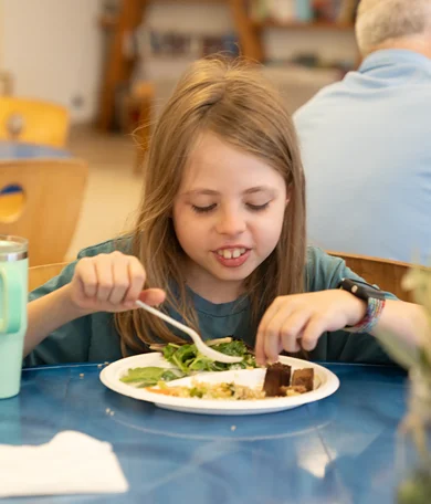 Student Eating Healthy Lunch at MUSE Global