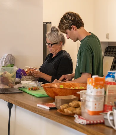 MUSE Global Chef with Student Preparing Food